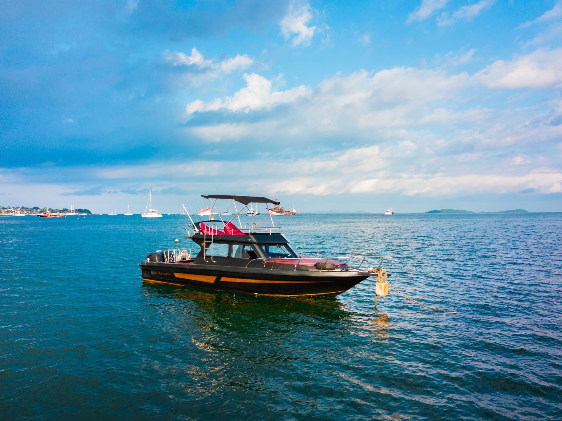 Boat on turquoise water during a Bali sunset cruise