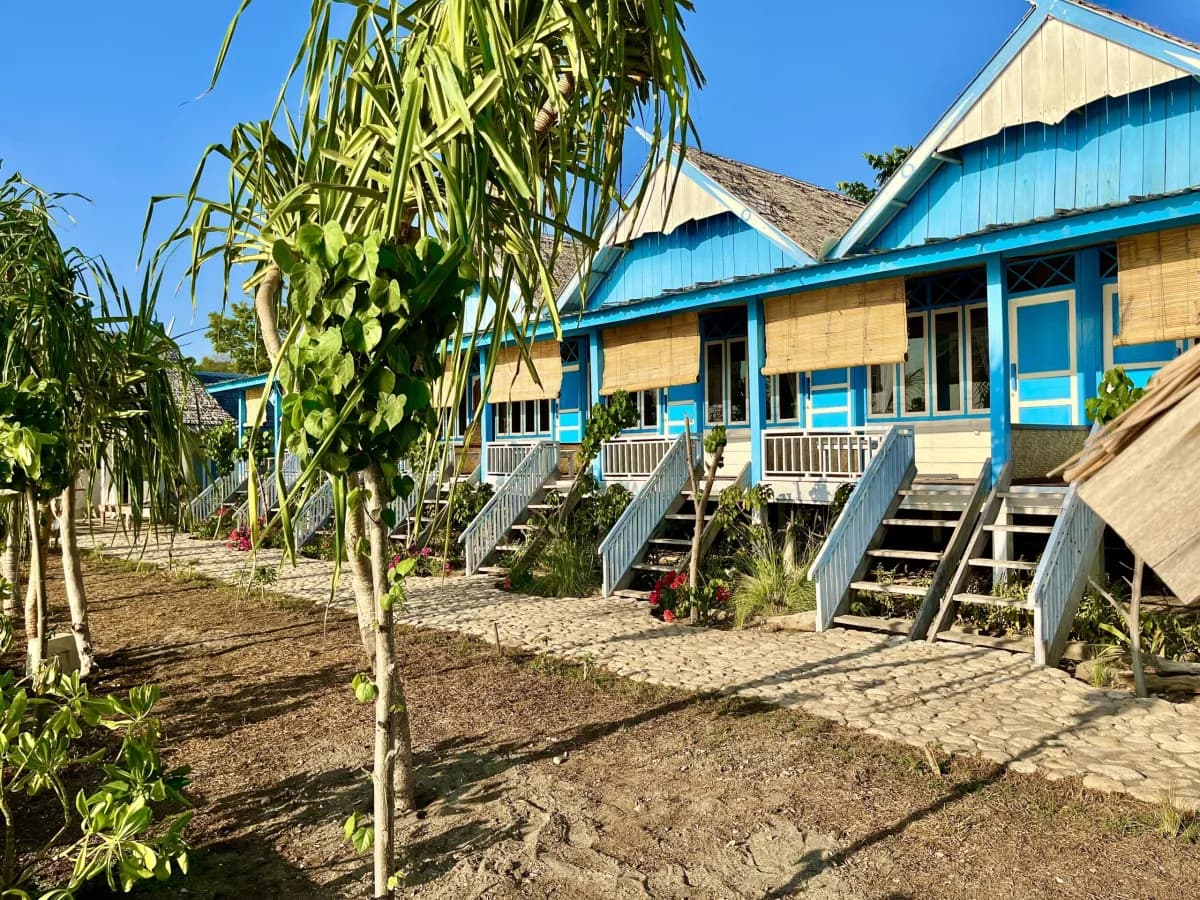 Row of beachfront bungalows at Moyo Island Resort